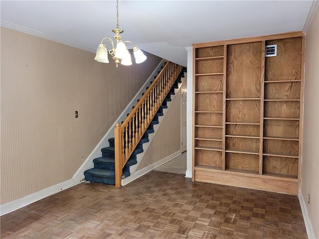 stairs featuring an inviting chandelier, dark parquet floors, and crown molding