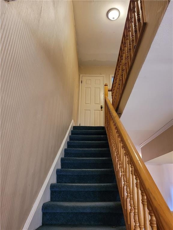 staircase with ornamental molding