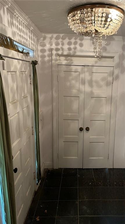 doorway to outside with tile flooring and ornamental molding