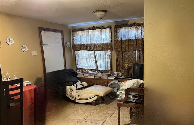 living area featuring light tile floors