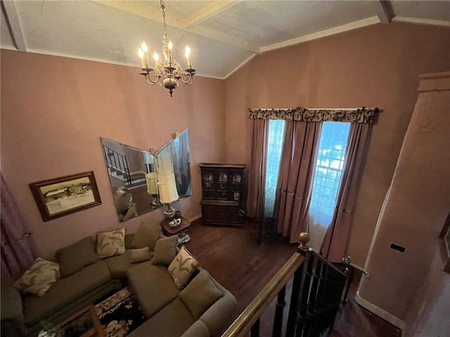 living room with lofted ceiling, ornamental molding, dark wood-type flooring, and an inviting chandelier