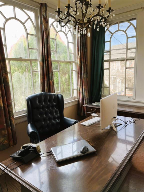 home office with a notable chandelier