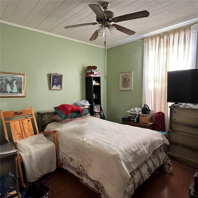 bedroom featuring wooden ceiling, ornamental molding, ceiling fan, and dark hardwood / wood-style flooring