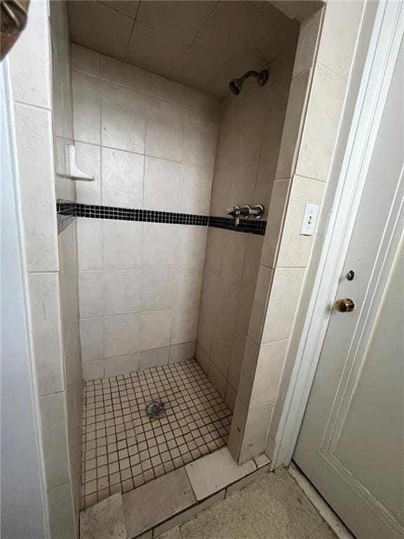 bathroom with tiled shower