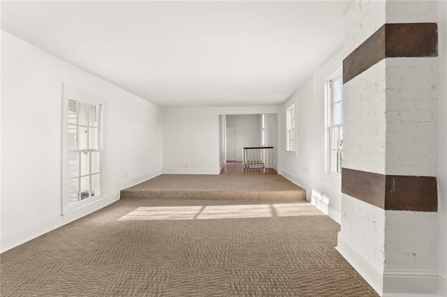 unfurnished room with dark colored carpet