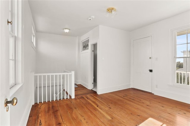 unfurnished room with dark wood-type flooring