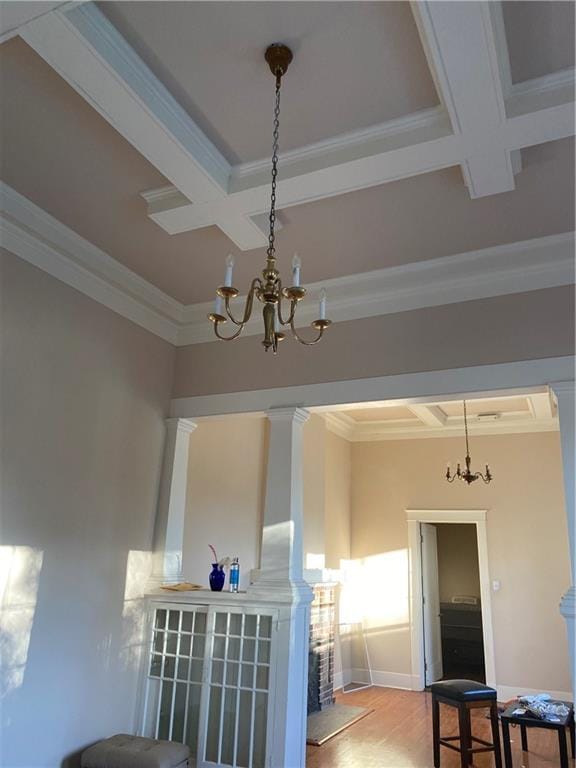 161214 N Broad St, New Orleans, LA 70119 - interior space featuring coffered ceiling, beam ceiling, crown molding, and an inviting chandelier