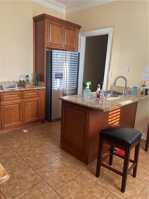 161214 N Broad St, New Orleans, LA 70119 - kitchen featuring sink, ornamental molding, kitchen peninsula, and stainless steel refrigerator with ice dispenser