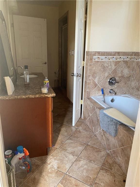 161214 N Broad St, New Orleans, LA 70119 - bathroom with tile floors, vanity, and a tub