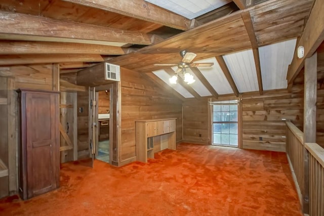 additional living space featuring lofted ceiling with beams, carpet, ceiling fan, and wood walls