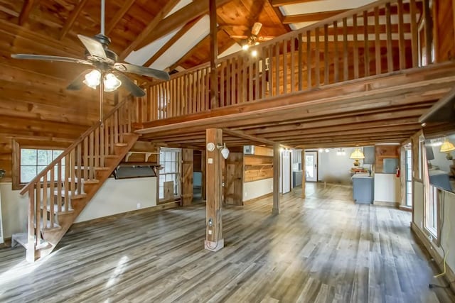 interior space featuring high vaulted ceiling and hardwood / wood-style flooring