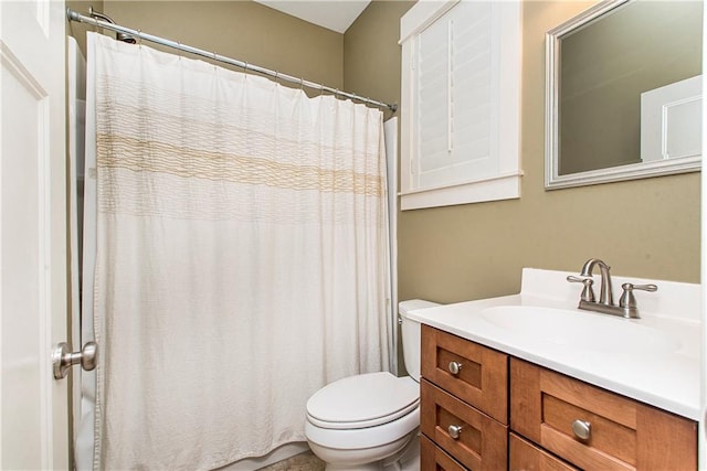 bathroom with toilet and vanity