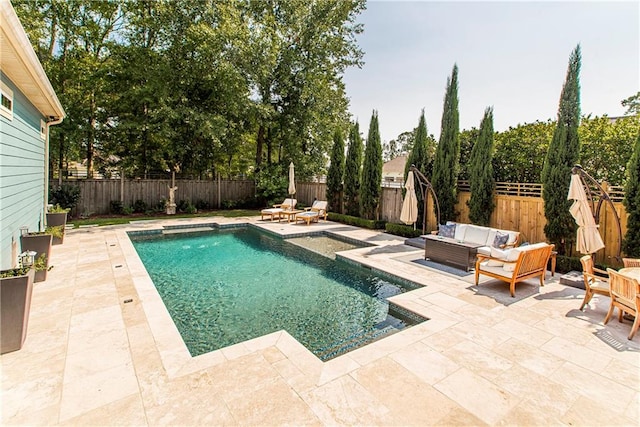 view of pool featuring a patio and an outdoor living space