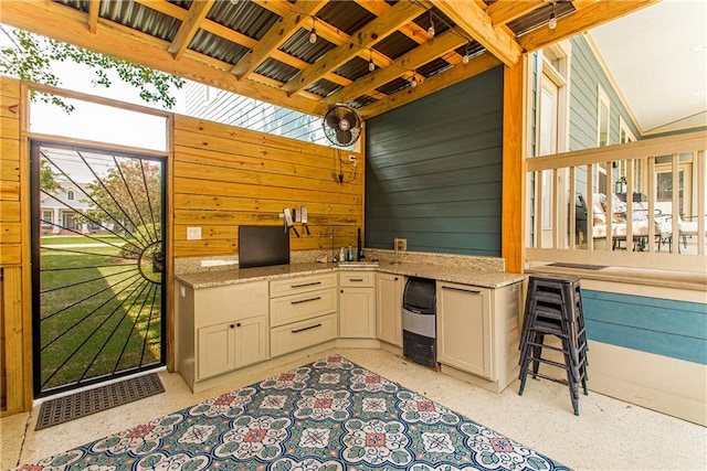 view of terrace with an outdoor kitchen