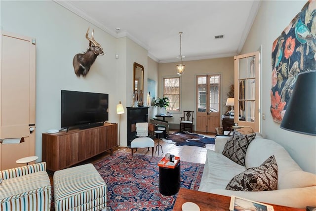 living room with dark hardwood / wood-style flooring and ornamental molding