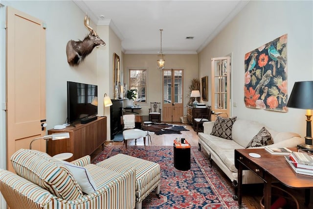 living room featuring dark hardwood / wood-style flooring and crown molding