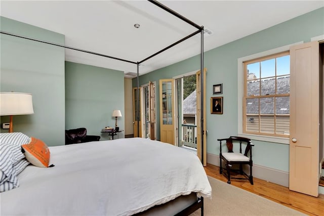 bedroom with light hardwood / wood-style floors