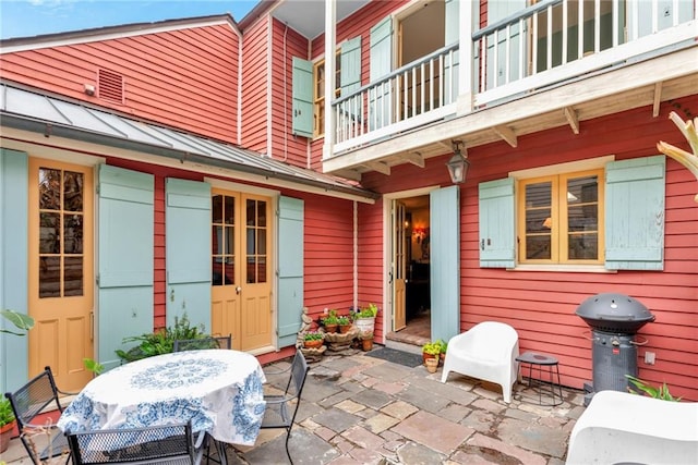 view of patio with a balcony