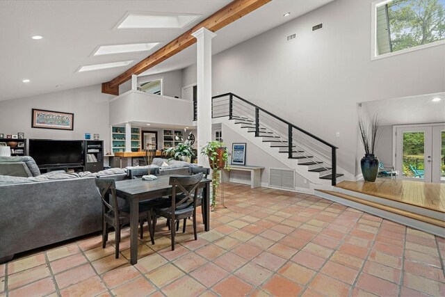 dining room featuring high vaulted ceiling, beamed ceiling, a healthy amount of sunlight, and light tile patterned floors