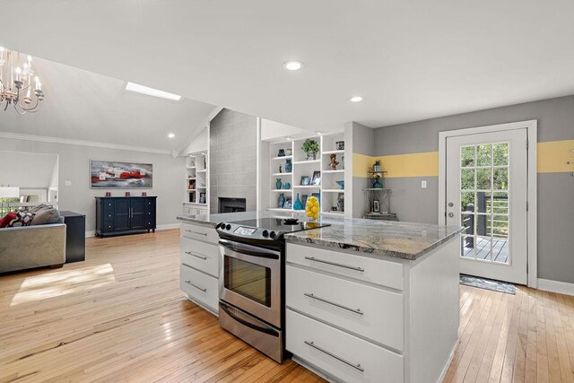 kitchen with white cabinetry, lofted ceiling, light hardwood / wood-style flooring, light stone counters, and electric stove