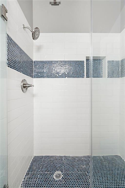 bathroom with an enclosed shower