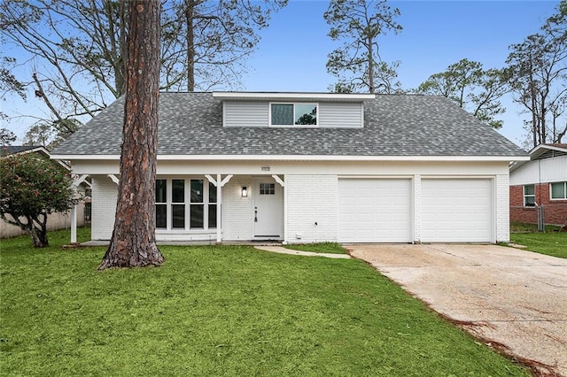 front facade featuring a front lawn and a garage