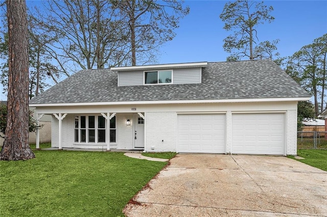 front facade featuring a garage and a front lawn