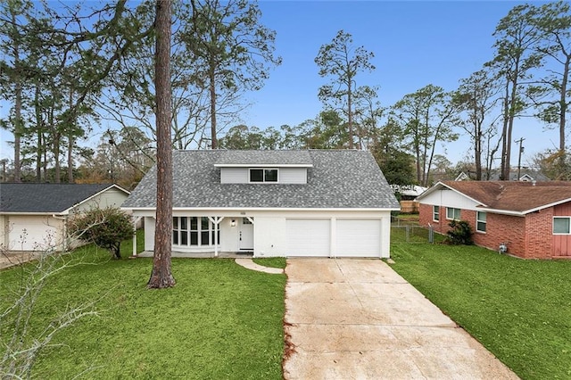 front of property featuring a garage and a front yard