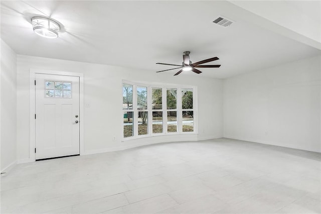 interior space with ceiling fan