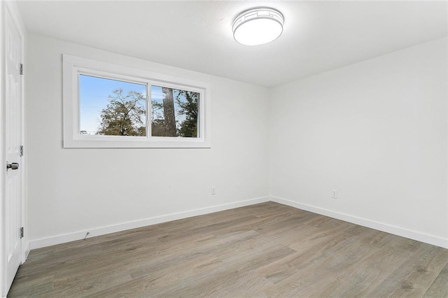 empty room featuring hardwood / wood-style flooring