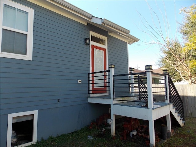 rear view of house featuring a deck