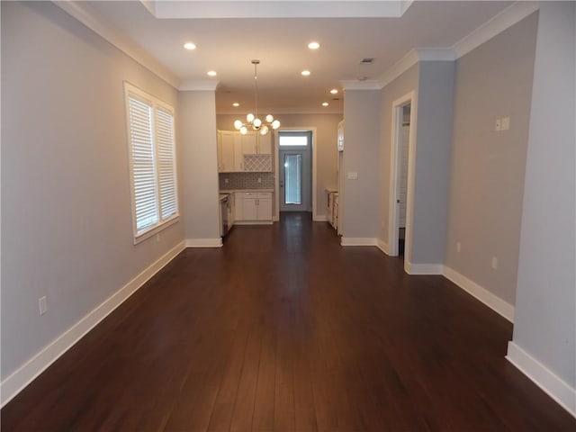 interior space with crown molding, dark hardwood / wood-style floors, and an inviting chandelier