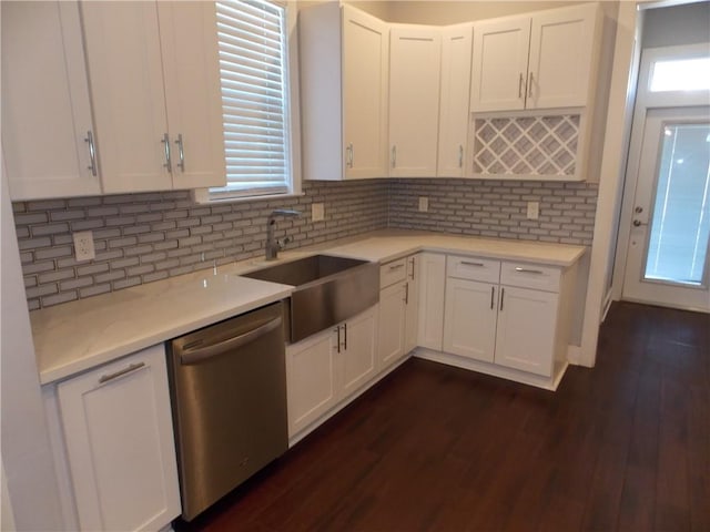 kitchen featuring dishwasher, dark hardwood / wood-style floors, tasteful backsplash, and sink