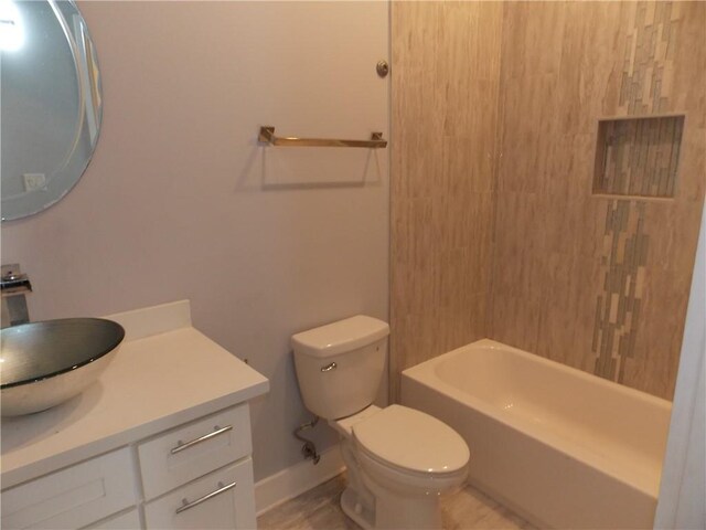 full bathroom featuring toilet, shower / bath combination, and vanity