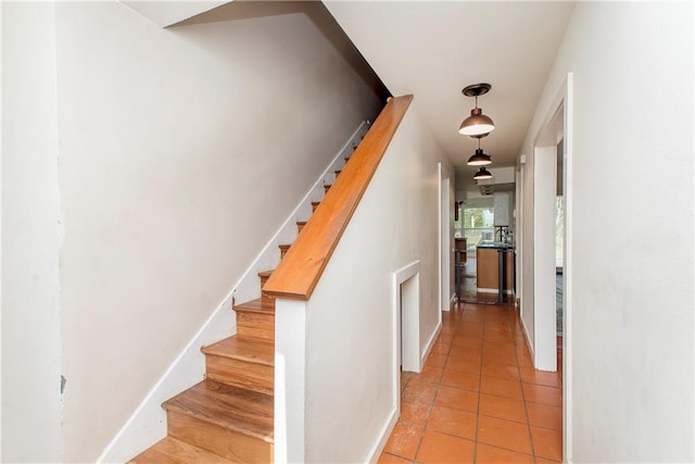 stairs with light tile floors