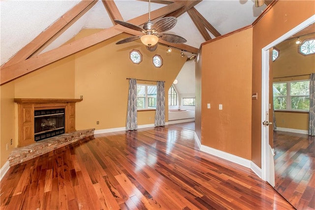 unfurnished living room featuring high vaulted ceiling, ceiling fan, dark hardwood / wood-style flooring, and beamed ceiling