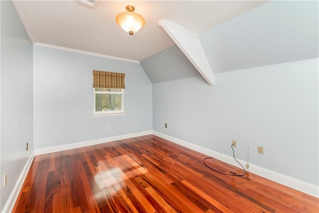 additional living space with lofted ceiling and dark hardwood / wood-style floors