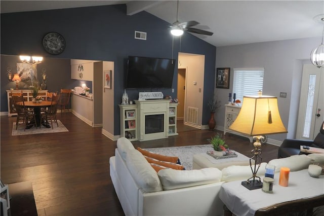 living room featuring dark hardwood / wood-style floors, ceiling fan with notable chandelier, and lofted ceiling with beams