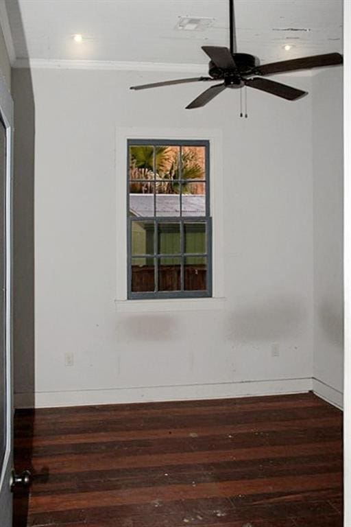 unfurnished room featuring hardwood / wood-style floors, ceiling fan, and ornamental molding