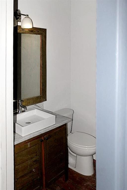 bathroom with toilet and vanity