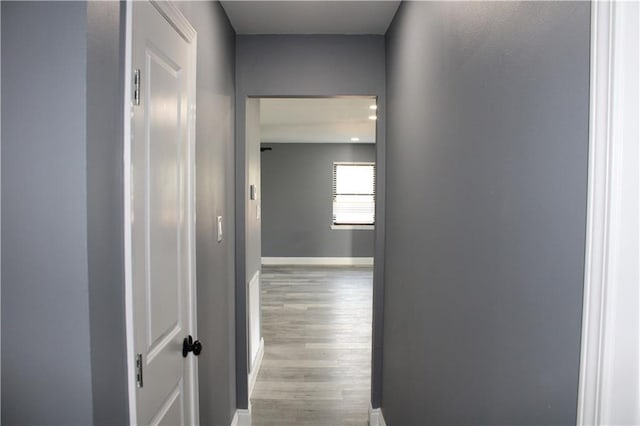 hall with light hardwood / wood-style floors