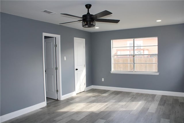 unfurnished bedroom featuring light hardwood / wood-style flooring and ceiling fan