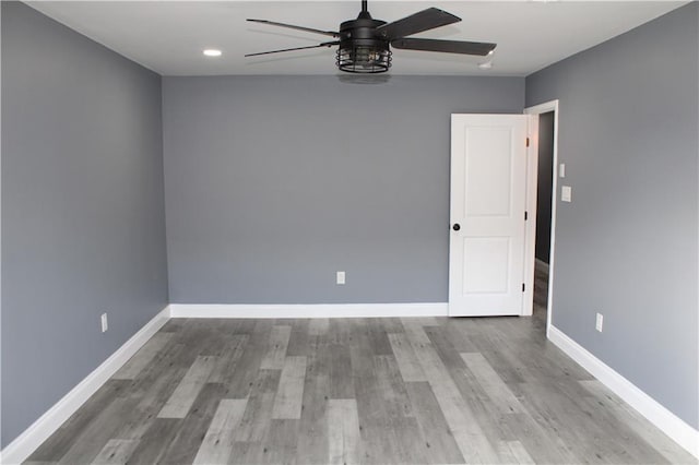 unfurnished room featuring ceiling fan and light hardwood / wood-style flooring