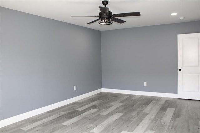 unfurnished room featuring ceiling fan and light hardwood / wood-style floors