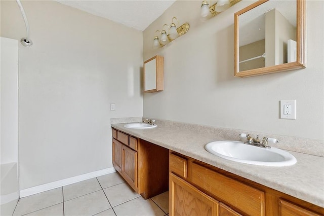 bathroom featuring tile patterned flooring, vanity, and a tub