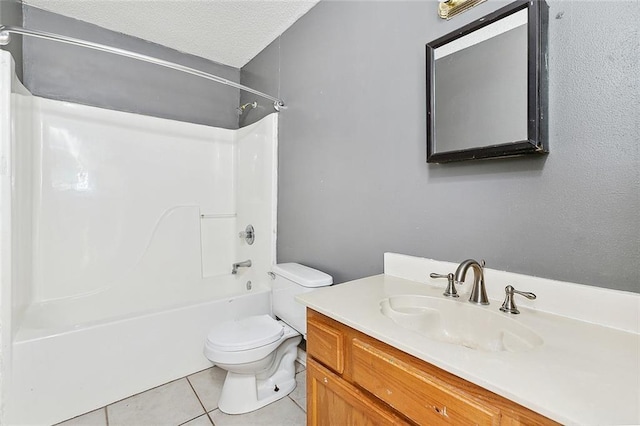 full bathroom featuring a textured ceiling, vanity, toilet, tile patterned floors, and washtub / shower combination