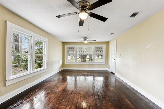 interior space featuring ceiling fan and dark hardwood / wood-style floors