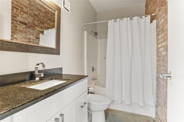 full bathroom with brick wall, toilet, shower / tub combo with curtain, and vanity