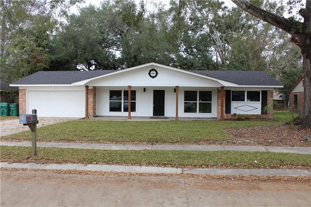 single story home with a front lawn, a porch, and a garage