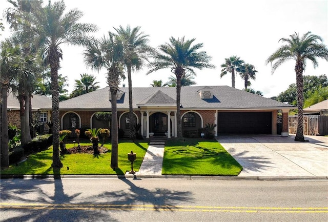 ranch-style house with a front lawn and a garage